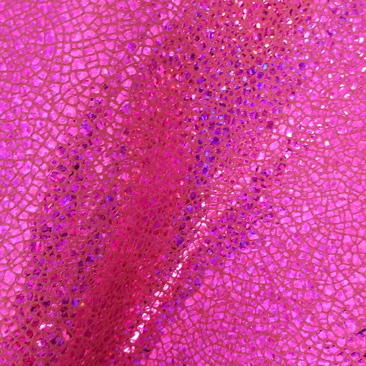 Close-up of an iridescent foiled pink textured micro mosaic pattern