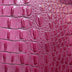 Close-up of pink crocodile skin texture