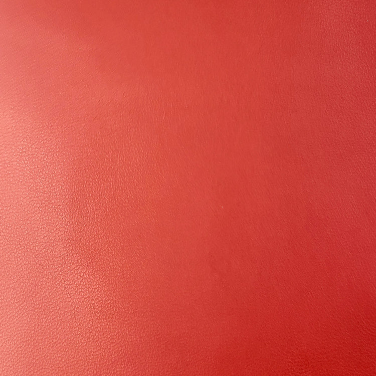 Solid red color swatch with a textured surface